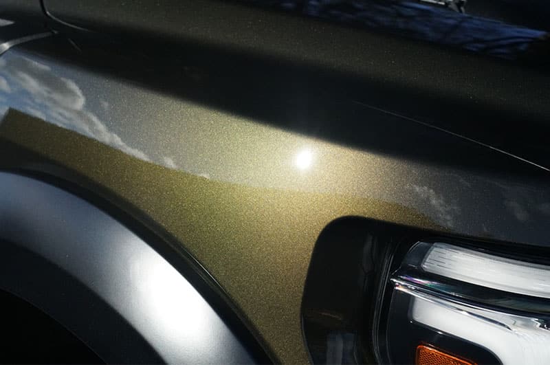 Fresh PPF Install on a 2025 Ford Raptor Green shiny Paint front headlight view