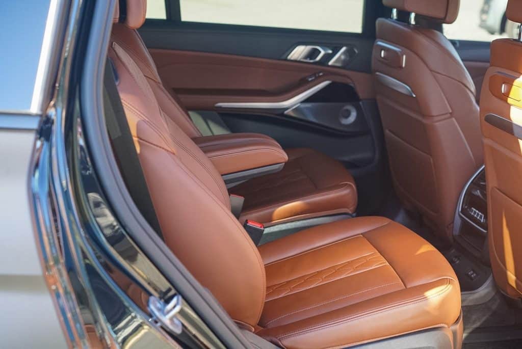 Second-row tan leather seats in a BMW X7 M60i after an Essential Interior detail, Chantilly VA